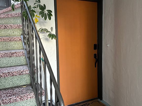 Front door of unit #436, with smart lock.