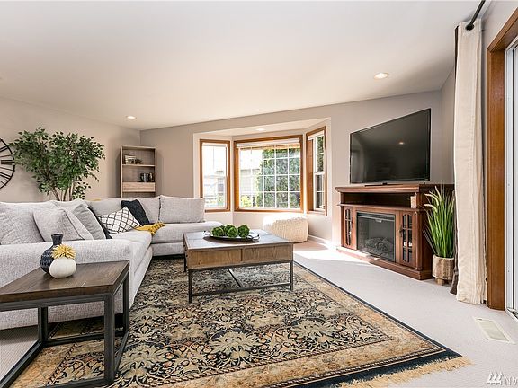 Big living room! slider to deck on the right. Electric fireplace unit included!