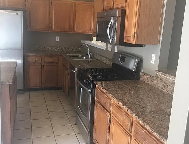 Kitchen with Granite countertops, Stainless Steel Applicances
