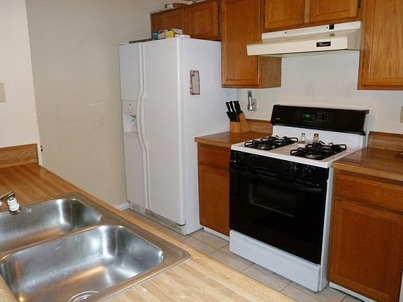 Quaint kitchen has a good size pantry and cabinets to hold all of the cook's toys.