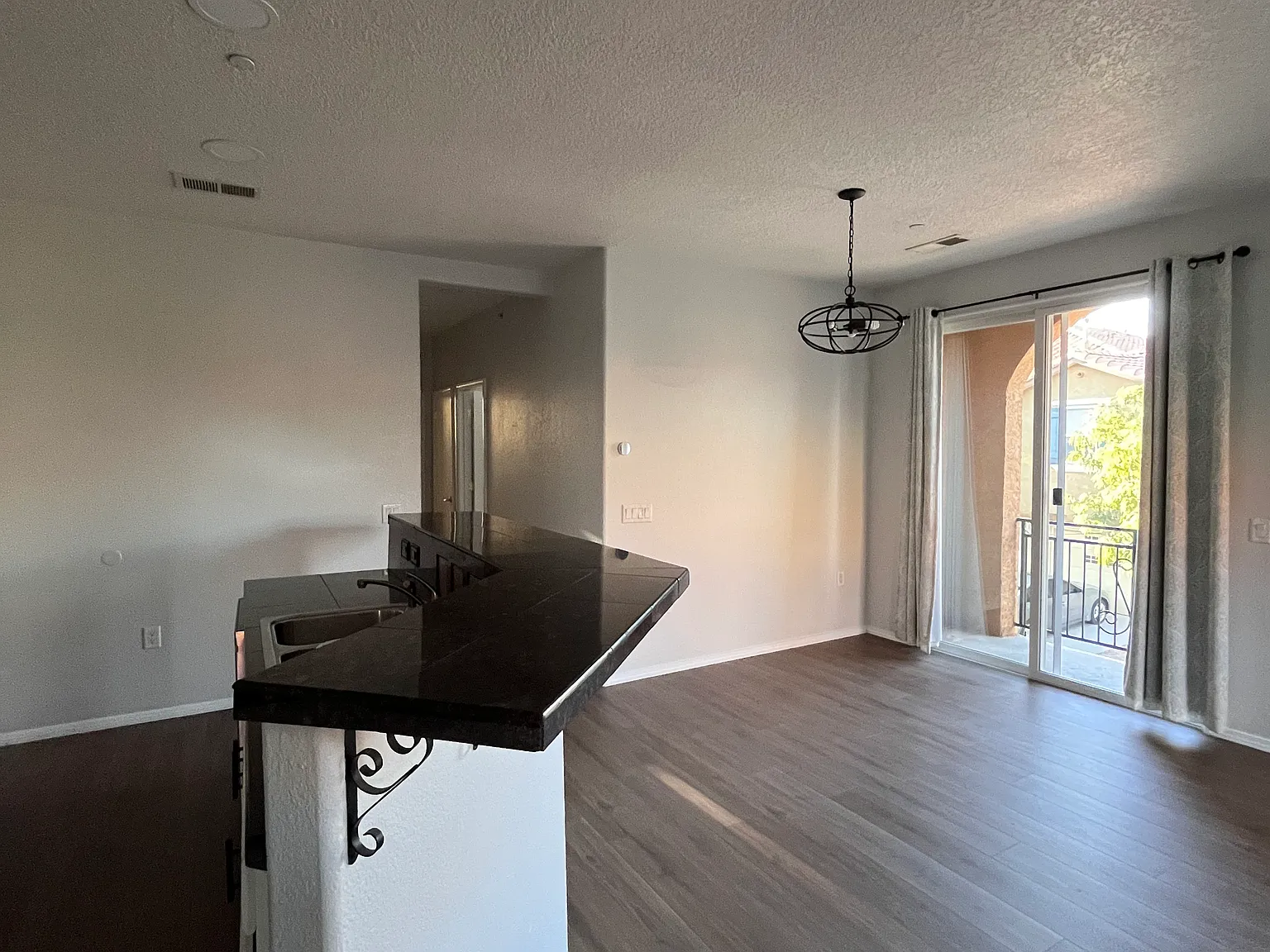 Entry into main level with kitchen, dining area and living area