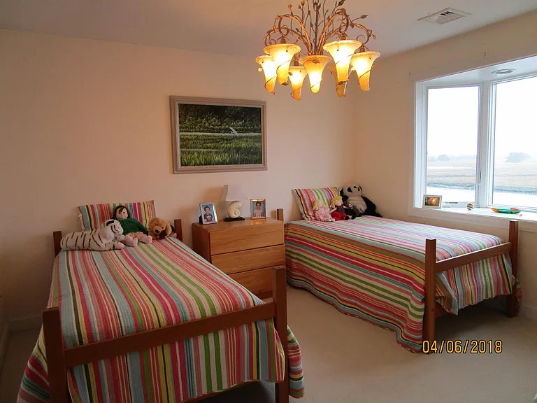 children's bedroom - two single beds, two chests , view to west