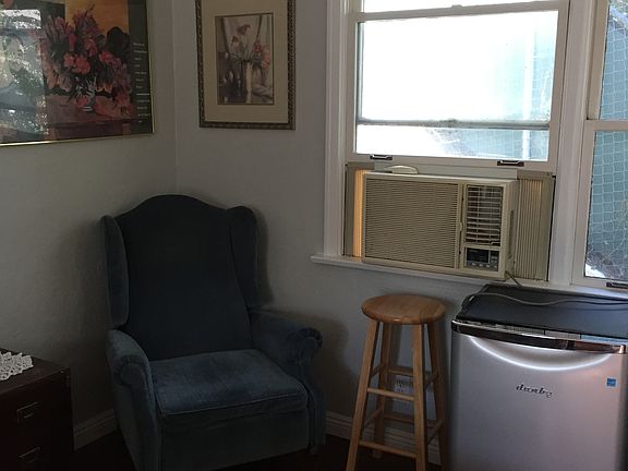 REFRIGERATOR, AIR CONDITIONER, RECLINER. TWO LARGE WINDOWS WITH VIEW OF THE MOUNTAIN.