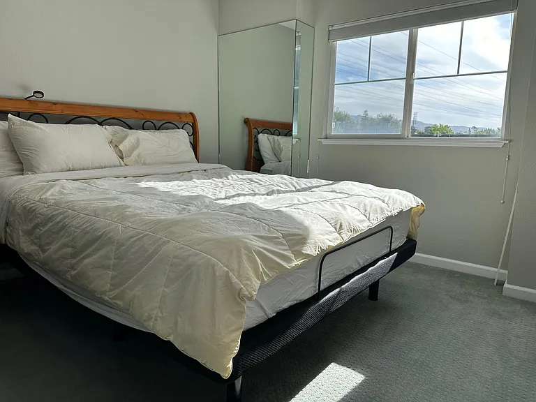 Bedroom towards the back on the 3rd floor. Each bedroom has attached and private full bathroom.