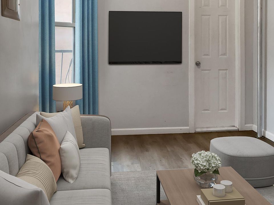 Visually enhanced: Cozy living room with plenty of sunshine.