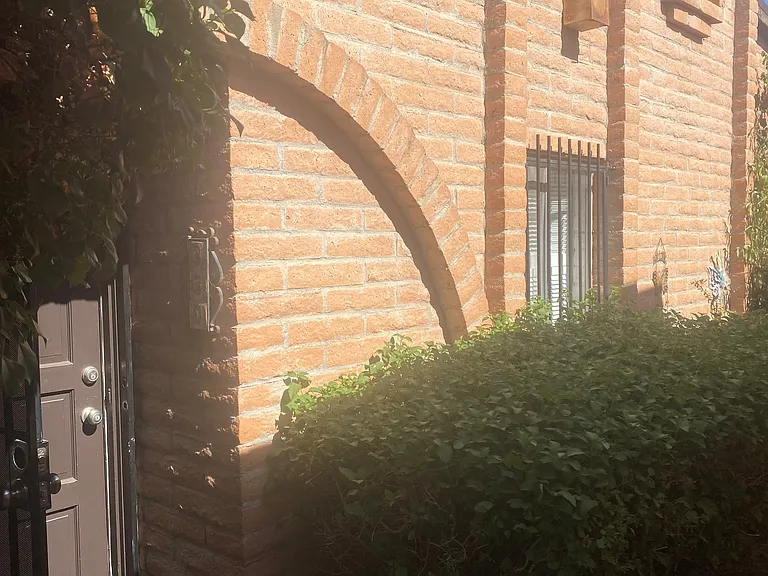 Attractive red brick exterior, with lots of character.