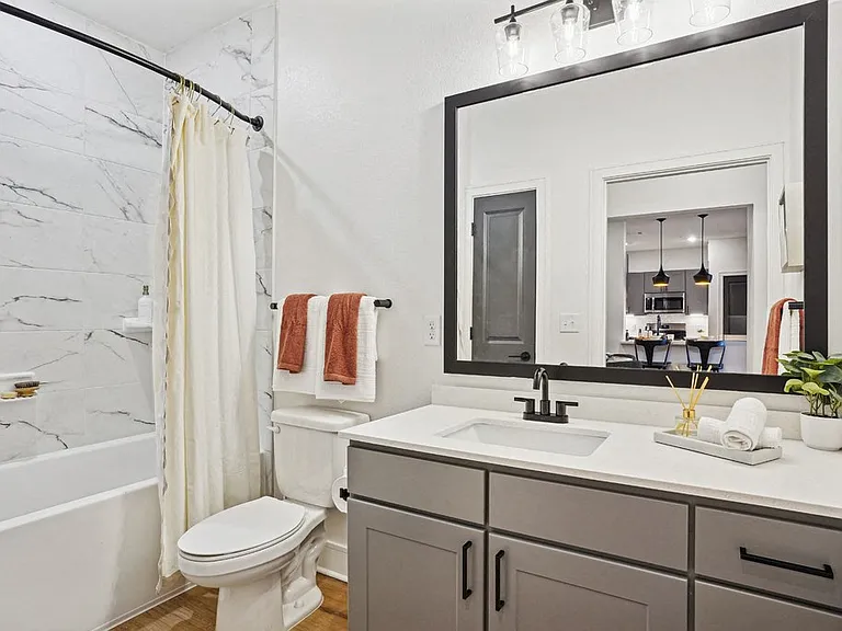 Bathroom with Quartz Countertop and Soaking Tub