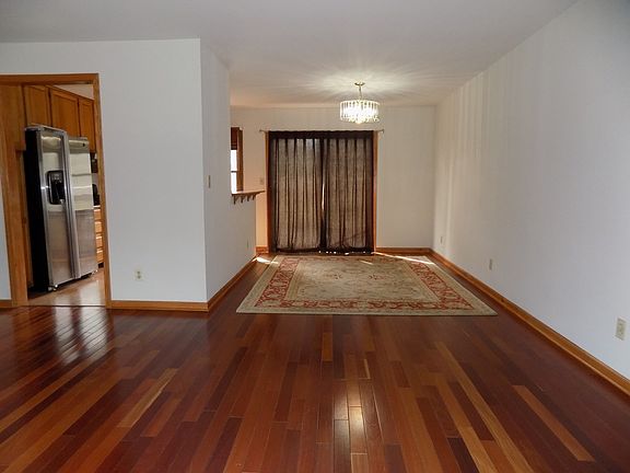 Dining Room with Hardwood Floors and Patio doors that lead to back deck.