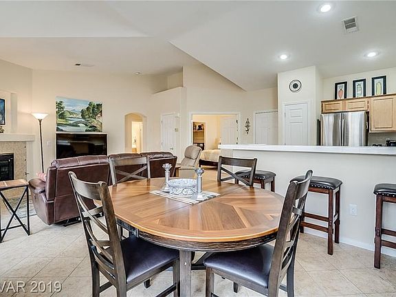 DINING AREA WITH BREAKFAST BAR.