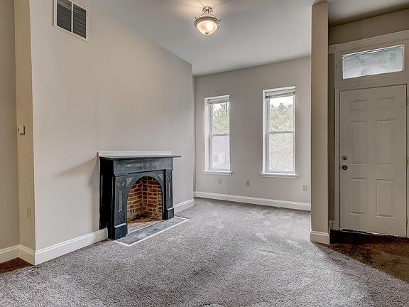 Living room -- original fireplace mantel!
