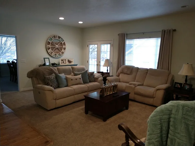 Opposite view of family room with French doors that exit to side covered deck.