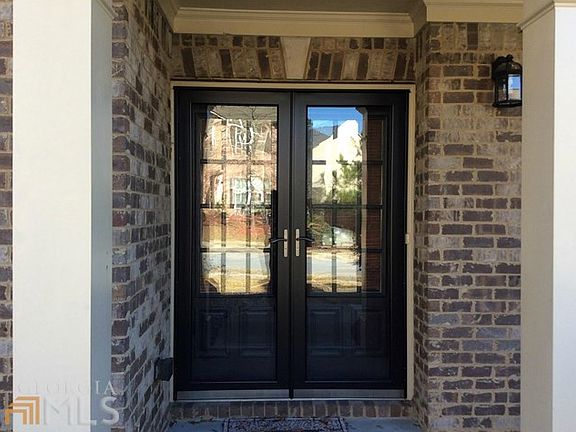 Storm doors on entry french doors.
