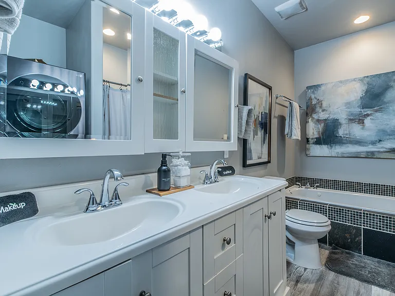 Spacious double vanity and soaking tub for ultimate convenience.