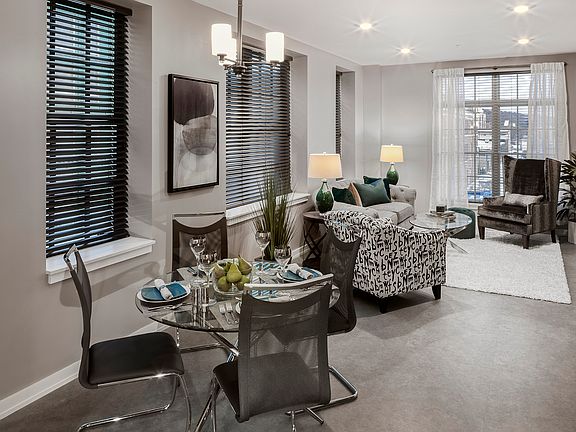 Spacious dining and living areas with abundant natural light.