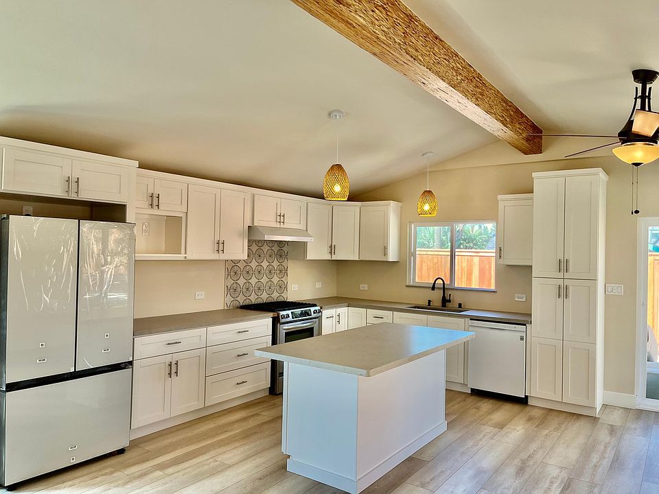 Spacious kitchen with designer refrigerator.