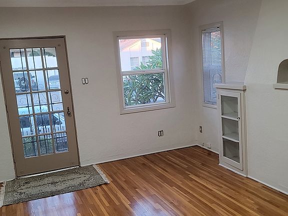 Large living with with beautiful hardwood floors.