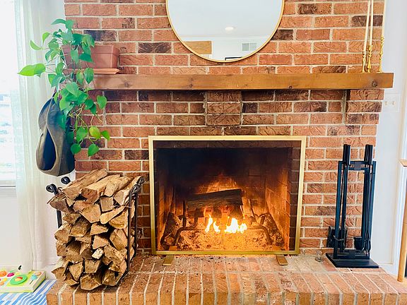 Fireplace. Wood storage outside by garden shed.