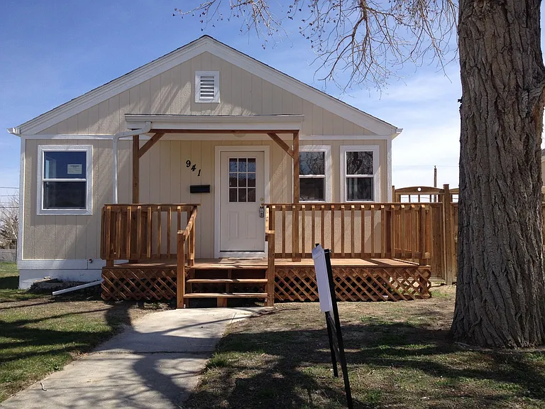 Front of house, one off street parking space to the right of the tree.