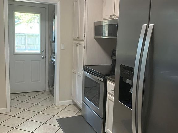 Included in Kitchen is all stainless appliances including gas stove and oven, fridge with ice-maker, dishwasher, microwave, washing machine and dryer combo.