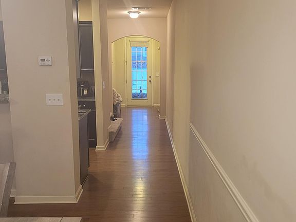 Dinning area looking towards front foyer and Entrance Door.