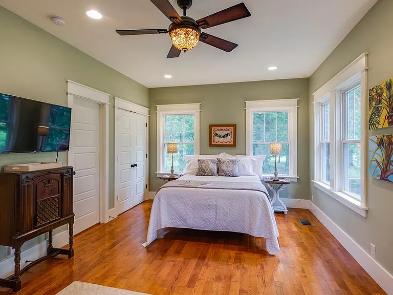 The second bedroom has a bathroom next to it. The bathroom also opens to the grand living room.