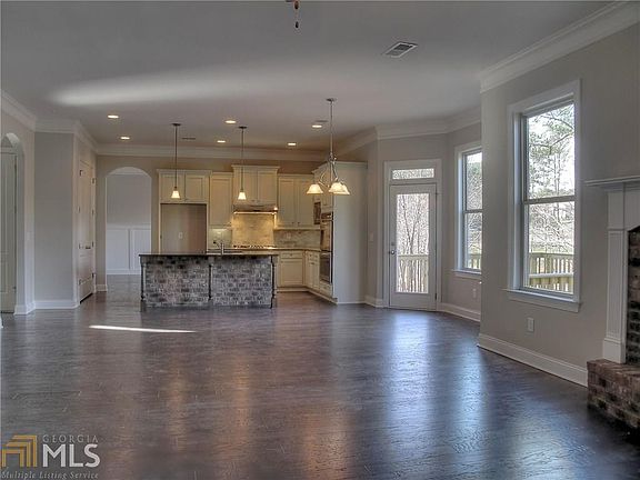 VIEW FROM FAMILY ROOM TO BREAKFAST ROOM AND KITCHEN