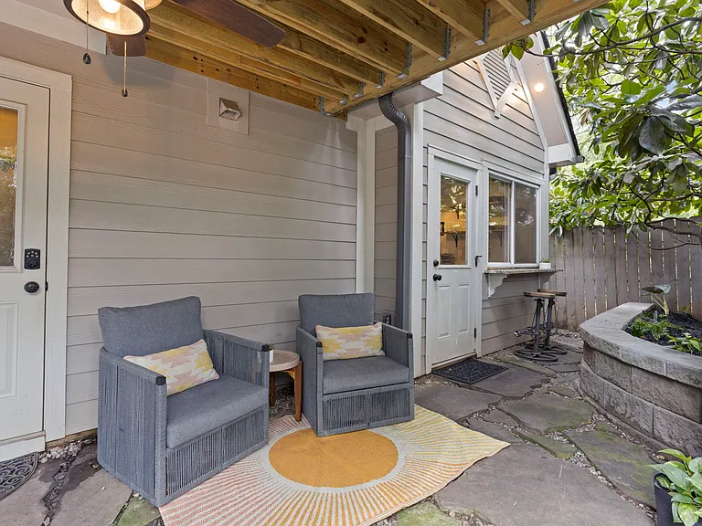 Outdoor covered seating area in the beautiful landscaped garden