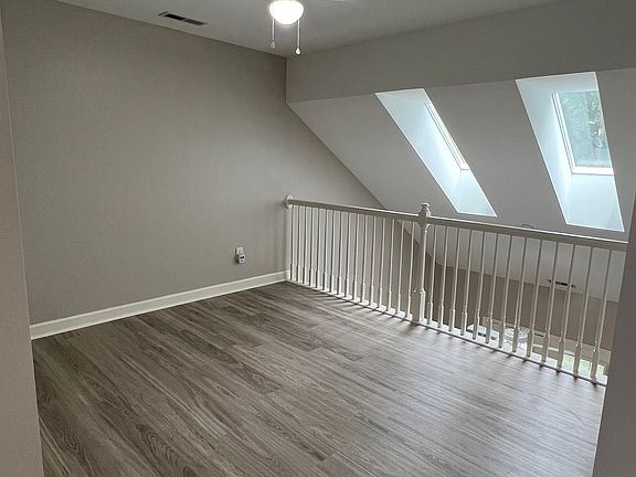 2nd floor loft with brand new fan and a closet for extra storage. The loft overlooks the living room below.