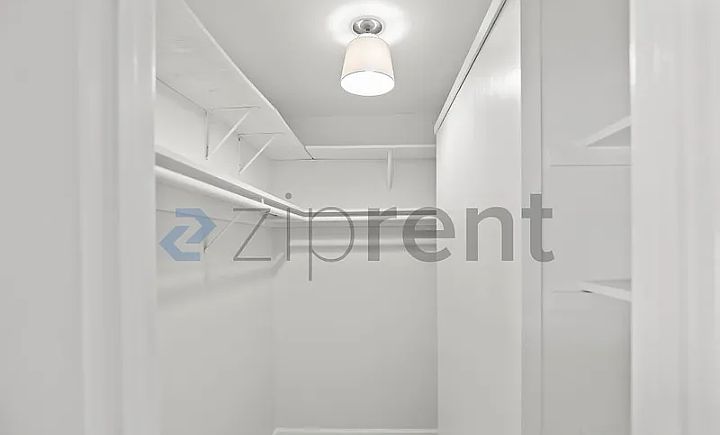 Walk-in closet which is located in bedroom