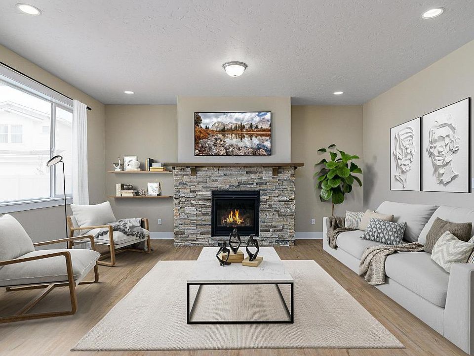A striking, stacked stone fireplace accents the spacious great room