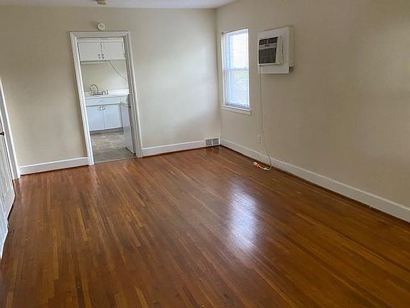 Living room with AC unit shown