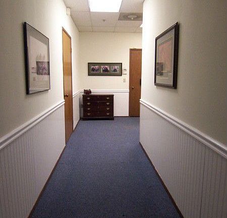 Massive open room is currently divided into several work areas