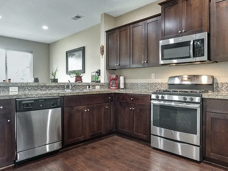 Spacious kitchen with lot of cabinets and pantry