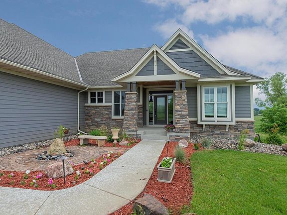 It's easy to be impressed by the custom details galore inside and out on this home! Architectural lighting and landscaping, in ground sprinkler system for the spacious yard and a welcoming entrance.