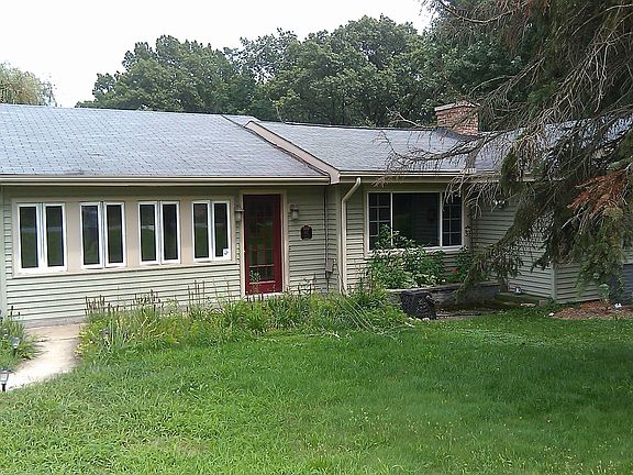 Front of the house, detached 2.5 car garage to the left
