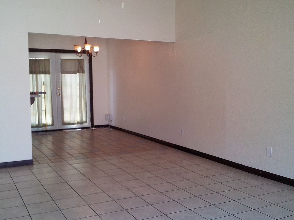 Tiled Living Room and adjoining dinning area
