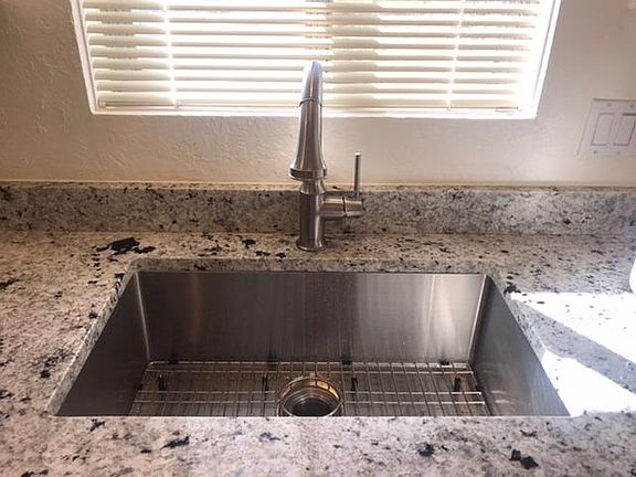 Gorgeous new granite countertops and Chef_s sink