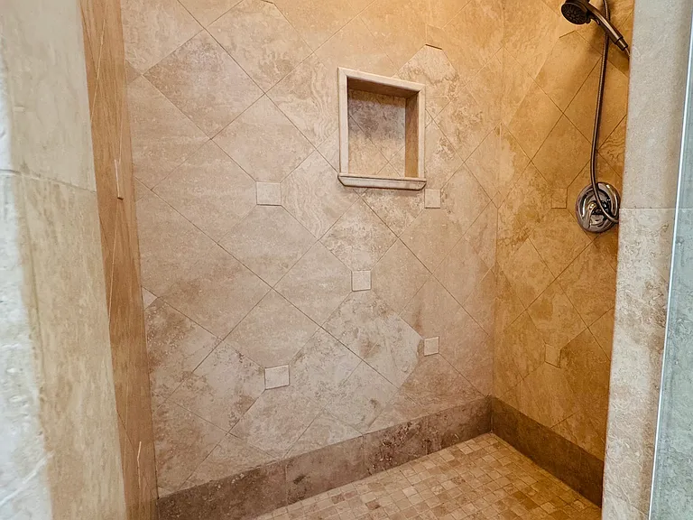 Primary bathroom step-in shower.