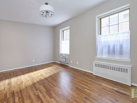 2nd image of 15 E 10th St APT 1G
