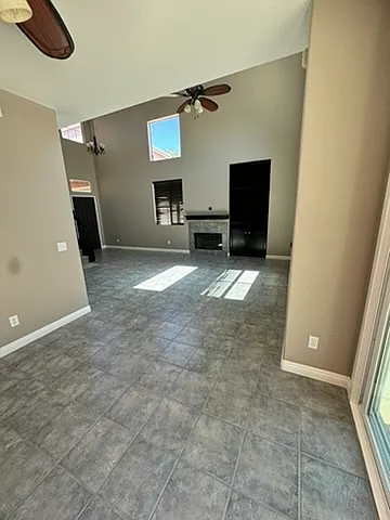 dining area view to living room with fireplace etc