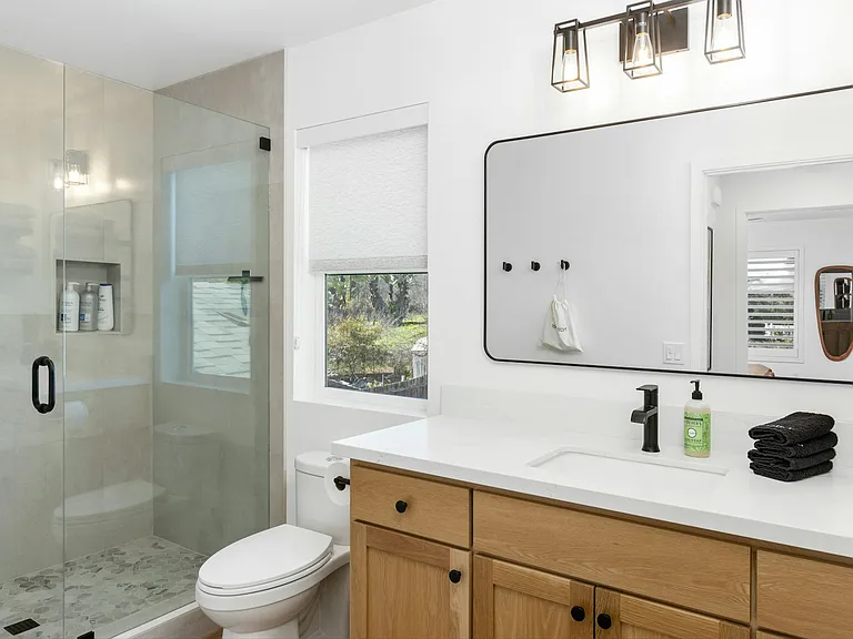 Full size bathroom with towels, and initial shampoo, conditioner, and body wash provided.