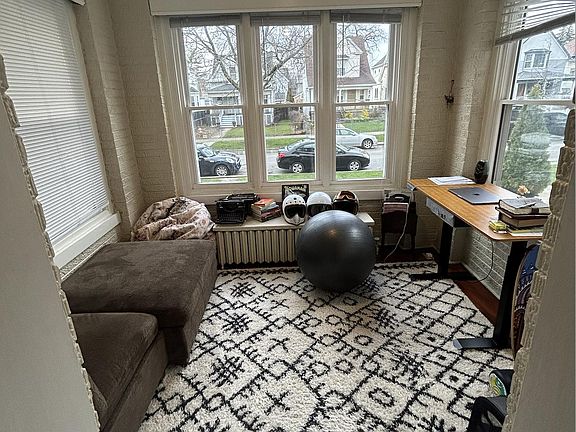 The North-facing front sunroom offers three walls of windows with ample indirect sunlight that stays cool in the summer.