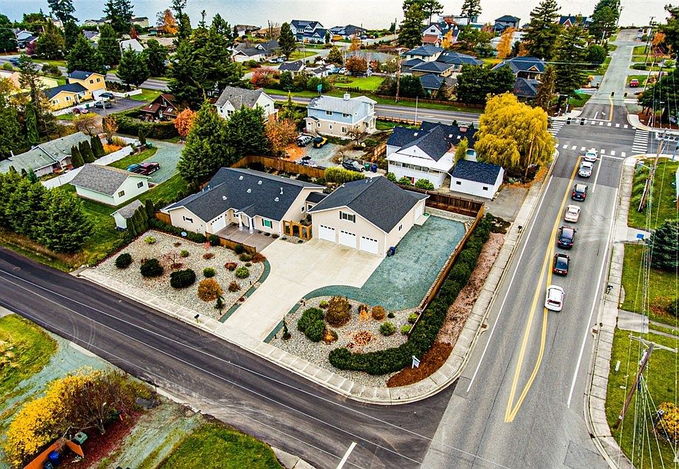 Take a look at this residence. This photo was just shot 11/14/19. what's different is the parking area to the right. We removed a small shed and adjusted a block wall. What we achieved is to open up access to a shop. it is roughly 15 by 35 feet with a overhead door for access. 