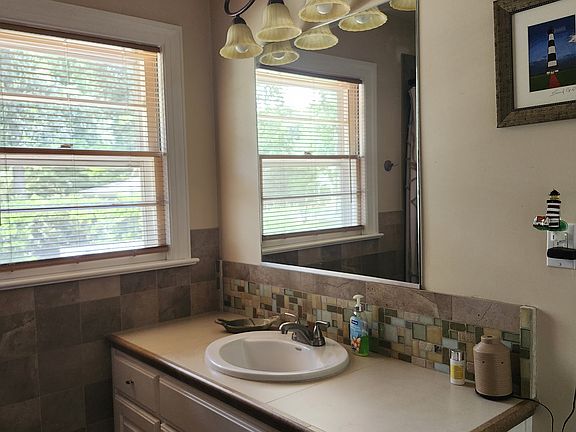 Bathroom Sink/ Looks out to Back Yard Area