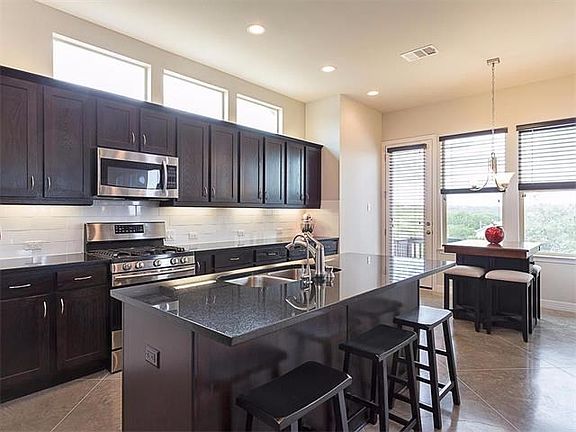 Granite and Stainless Steel throughout the kitchen.