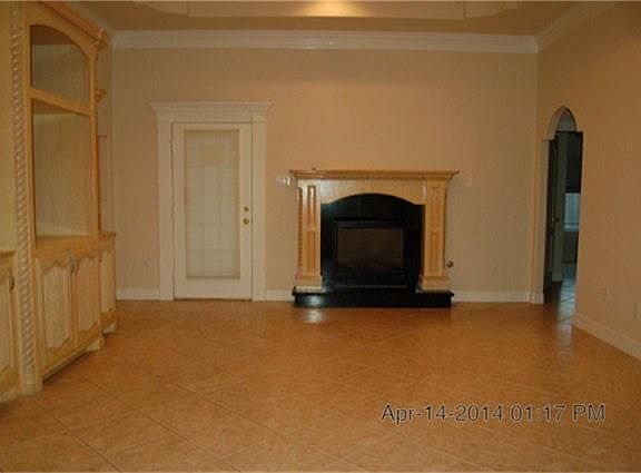 Den/Living area with gaslog fireplace and built in entertainment center