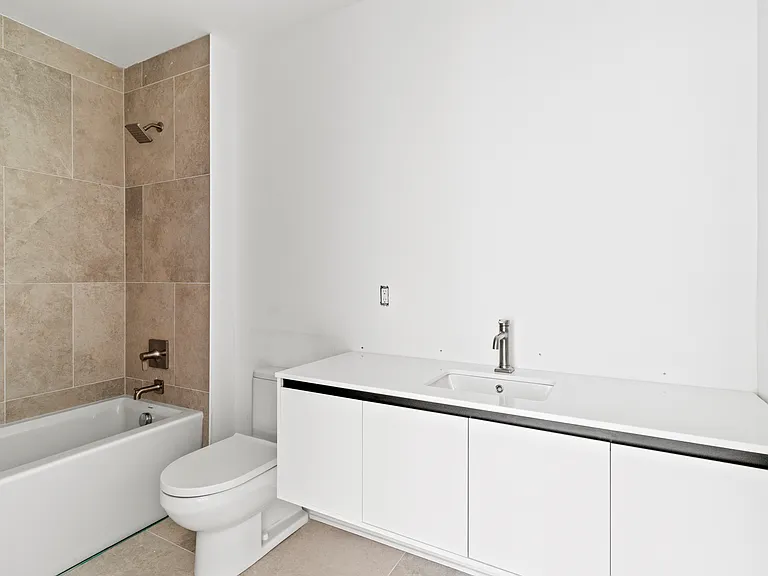 primary bathroom (mirrors and light fixtures have since been installed)
*photo of similar unit, exact finishes and layouts may vary*
