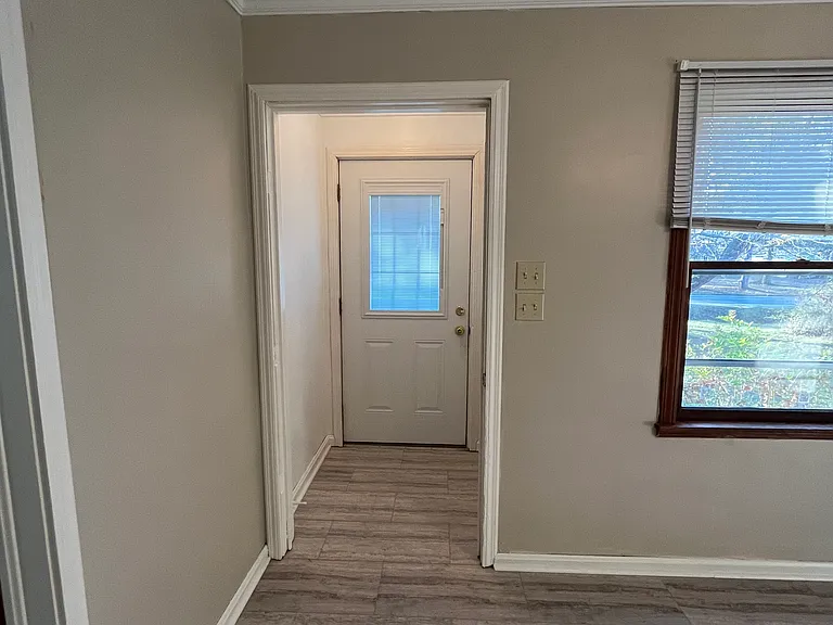 Entry off of the front porch, leading into the dining area