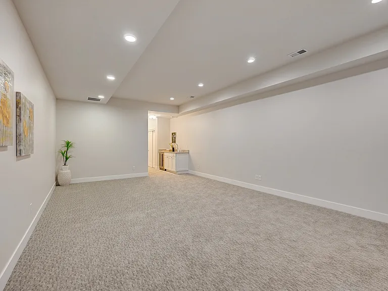 Lower Level Recreation Room with Wet Bar and Refreshment Refrigerator