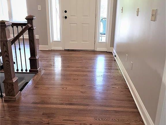 Wide entry with side lights and wonderful wood floor!